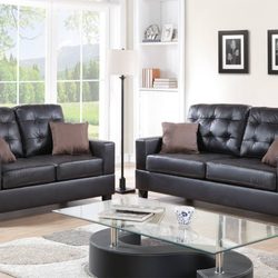 Tri-City Furniture - Faux Leather Sofa and Loveseat set.