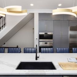 Chi Renovation & Design - In the heart of Chicago's vibrant West Loop, this transformative renovation reimagined the main level of a distinguished home.