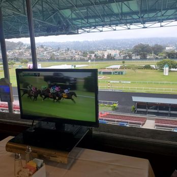 Turf Club - Golden Gate Fields - My table was across the Finish Line (Candy Cane Pole) - Horse Racing Near Me - Berkeley, California Turf Club - Golden Gate Fields - My table was across the Finish Line (Candy Cane Pole) - Horse Racing Near Me - Berkeley, California