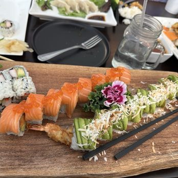 Bincho Tan Bistro - Island roll, California roll, and custom salmon roll and gyoza in the background - Japanese Near Me - Lutz, Florida