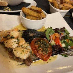 Brea - Tweed Valley 35 day dry aged Soz Ribeye Steak served with Roasted Flat Cap Mushroom, Confit Tomato and Hand Cut Chips. Surf and Turf.