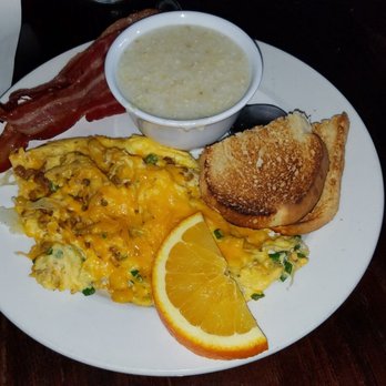 Famous Toastery - Southwestern Scramble, Grits, Sourdough Toast, and Bacon. - Breakfast & Brunch Near Me - Concord, North Carolina Famous Toastery - Southwestern Scramble, Grits, Sourdough Toast, and Bacon. - Breakfast & Brunch Near Me - Concord, North Carolina
