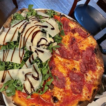 Rubirosa - Half arugula and hot honey pizza - Italian Near Me - New York, New York