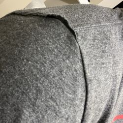 Brand new shirt never worn but looks like someone cut a sleeve off then re sewed it back on