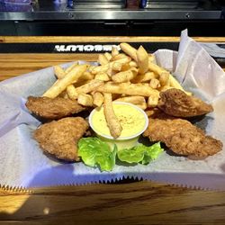 Devines Restaurant and Sports Bar - Chicken tenders with fries.