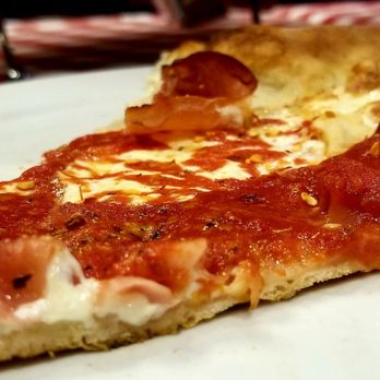 Grimaldi's Pizzeria - Single slice of that Large traditional pizza with prosciutto. - Pizza Near Me - Allen, Texas
