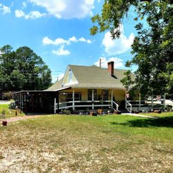 Blackwater Trail Antiques - June 2022: The exterior of the building; it sits on a large corner lot