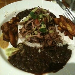 The Nibbler - Ropa served with plantains, beans and rice