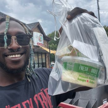 Fresh To Order - Me holding a bag containing the salmon Panini outside of the John Creek location - New American Near Me - Marietta, Georgia