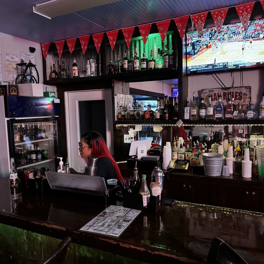 Tipsey’s Hole in The Wall - a bartender at the bar - Sports Bars Near Me - Slidell, Louisiana Tipsey’s Hole in The Wall - a bartender at the bar - Sports Bars Near Me - Slidell, Louisiana