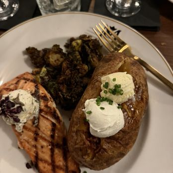 The Mercantile Chophouse - Salmon, loaded baked potato and brussel sprouts - Steakhouses Near Me - King, North Carolina The Mercantile Chophouse - Salmon, loaded baked potato and brussel sprouts - Steakhouses Near Me - King, North Carolina