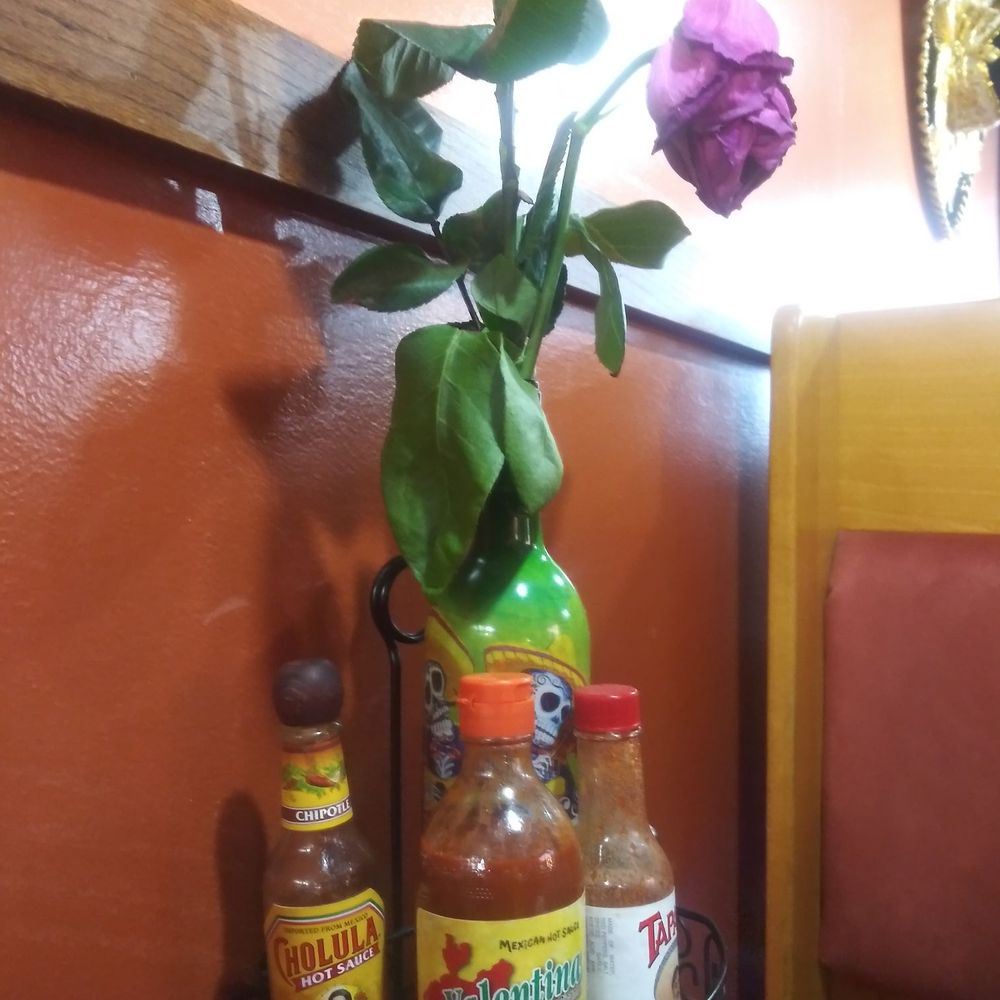 El Pariente Mexican Grill - 3 hot sauces at the table. When food arrives, 2 house made sauces hit the table as well. - Tacos Near Me - White Bear Lake, Minnesota