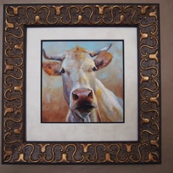 Stoll Custom Framing - Although the image of this cow was petite in size it still took a big frame to balance strength of the imagery.