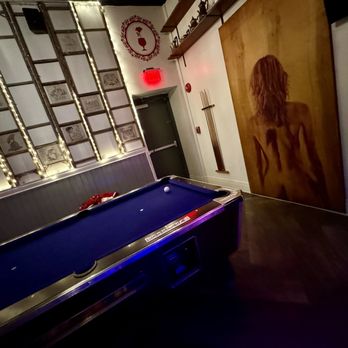House of Charm - a pool table in a dimly lit room - Dive Bars Near Me - Buffalo, New York House of Charm - a pool table in a dimly lit room - Dive Bars Near Me - Buffalo, New York