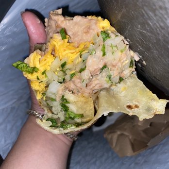 Herrera's Mexican Food - a hand holding a burrito - Mexican Near Me - Peoria, Arizona Herrera's Mexican Food - a hand holding a burrito - Mexican Near Me - Peoria, Arizona
