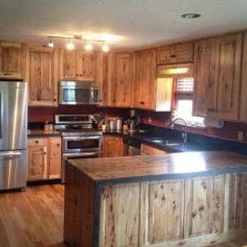 MTD Services - a kitchen with wood cabinets and stainless steel appliances - General Contractors Near Me - Columbia, South Carolina MTD Services - a kitchen with wood cabinets and stainless steel appliances - General Contractors Near Me - Columbia, South Carolina