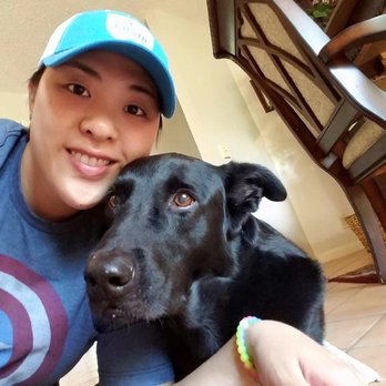 Aussie Mom Pet Sitting - Kona snuggling for a picture with Nancy during a visit. - Pet Boarding Near Me