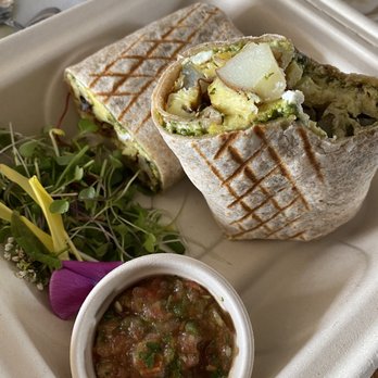 Beach Street Kitchen - Delicious pesto burrito with house-made salsa, beautifully presented in compostable containers. - Cafes Near Me - Yachats, Oregon