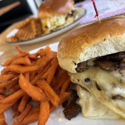 EC Diner - MAGIC MUSHROOM LE SUISSE Sweet Potato Fries  Background: EC DOUBLE SMASH Waffle Fries
