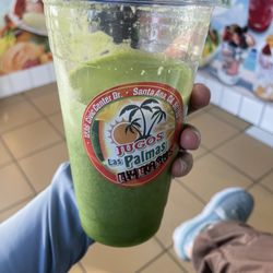 Green jugo with orange juice