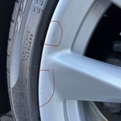 Unique Auto Spa Oil & Lube - Rim has paint chipped (Damage)after guide rail malfunction