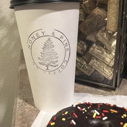 Caramel latte, chocolate donut with sprinkles. Caramel latte, chocolate donut with sprinkles.