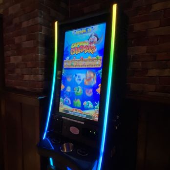 Schooner Pub - a slot machine with neon lights - Bars Near Me - Port Washington, Wisconsin