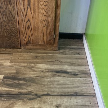 Dragonfly Tea Zone - The wall is covered with spilled drinks. The floor in the corner and the white ledge are filthy. - Coffee & Tea Near Me - Kansas City, Missouri