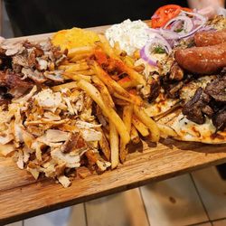 The Fat Greek - Mixed Grill - Sampling of Pork and Chicken Gyro Meat, Loukaniko, Pork, Chicken and Lamb Souvlaki, Tzatziki, Tirokafteri, Pita & Fries.