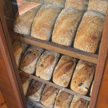 Domaselo - The window display of loafs. - Bakeries Near Me - Miami, Florida