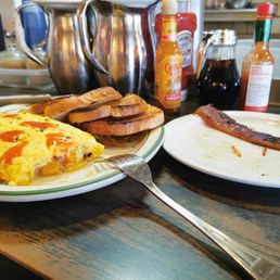 Ham and cheese omelet and one slice of the sweet bacon. I ate the other one before remembering to take a photo Ham and cheese omelet and one slice of the sweet bacon. I ate the other one before remembering to take a photo