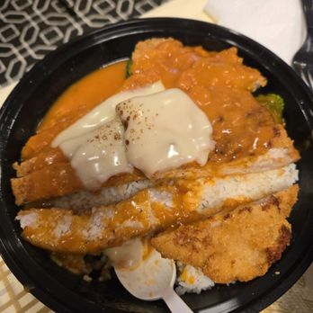 Marathon Cafe - Pork chop with tomato sauce and cheese over rice. - Chicken Wings Near Me - Little Neck, New York