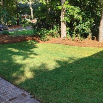 Gold Leaf Landscape - a brick path leading to a lush green lawn - Landscaping Near Me Gold Leaf Landscape - a brick path leading to a lush green lawn - Landscaping Near Me