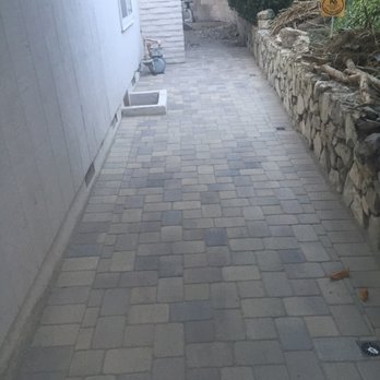 System Pavers - Side walkway was formerly dirt with white stones as border and a cinder block like path.  System Pavers also installed proper drainage!! - Masonry/Concrete Near Me - Orange, California