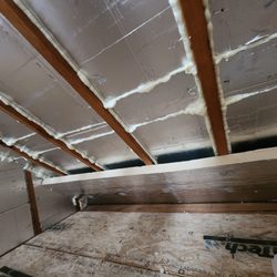 Calnan's Energy Systems - 4 inches installed and foamed between rafters, now capping it all with 2 inch Thermax insulation board