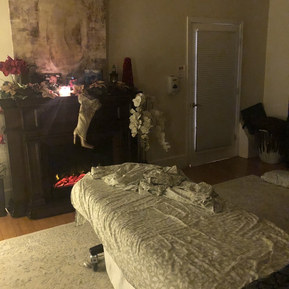 Body Kneads - Massage table with fireplace and bars above - Massage Therapy Near Me - Nashua, New Hampshire