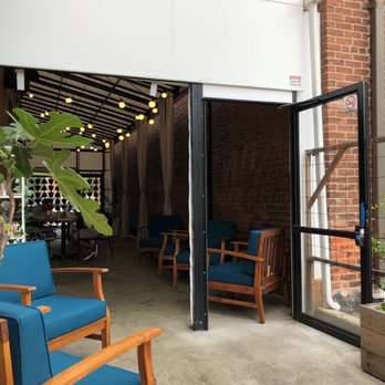 Bellflower - Covered patio from the uncovered seating - New American Near Me - Ypsilanti, Michigan