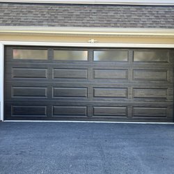 Garage Door Geeks - New black garage door with windows.