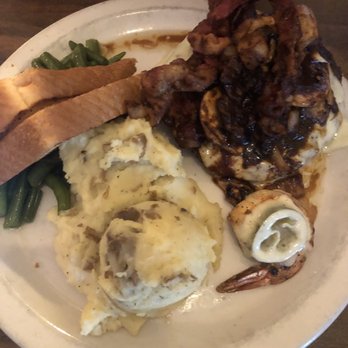 Lunkers Grill - Smothered patty with green beans and mashed potatoes with an added on Diablo shrimp - American Near Me - Uvalde, Texas