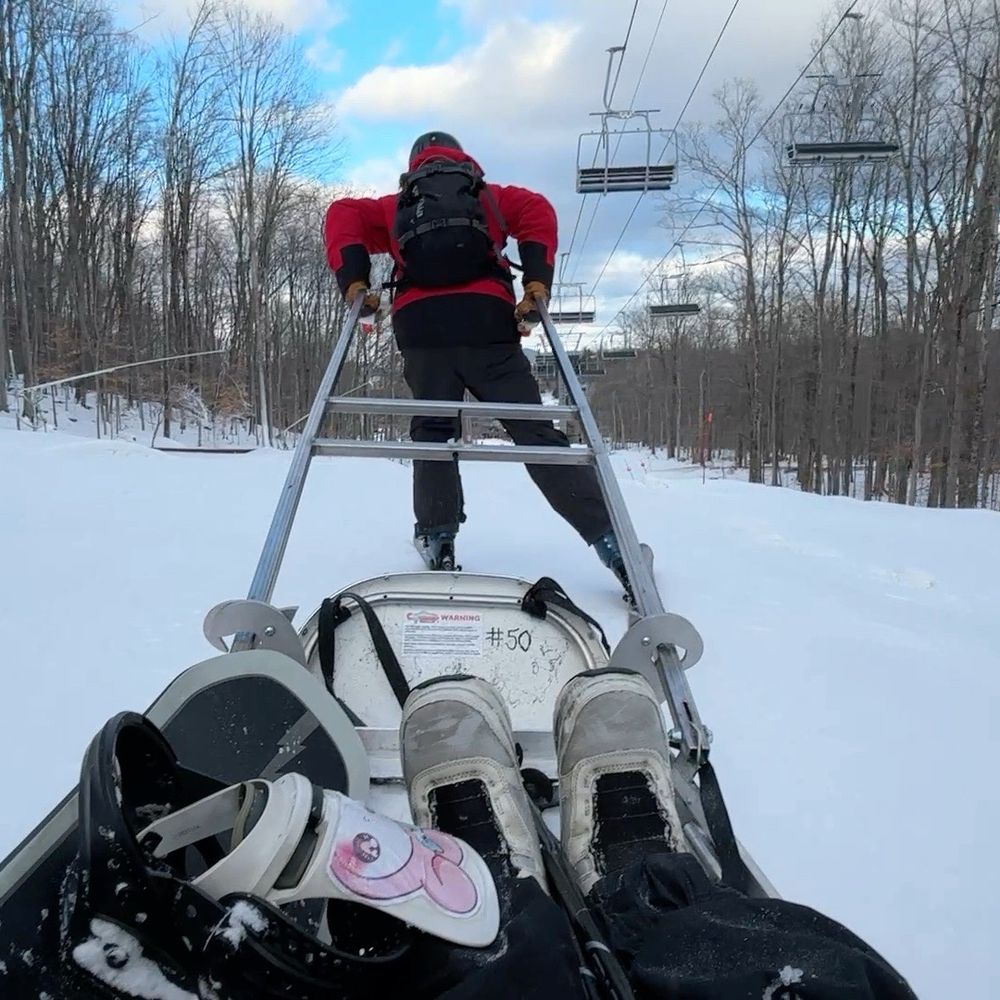 Gore Mountain - Ski patroller Zac and in a ski patrol toboggan at Gore. - Ski Resorts Near Me - North Creek, New York Gore Mountain - Ski patroller Zac and in a ski patrol toboggan at Gore. - Ski Resorts Near Me - North Creek, New York