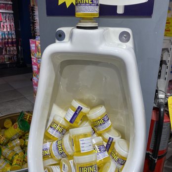 IT'SUGAR - a urinal filled with pills - Candy Stores Near Me - Las Vegas, Nevada