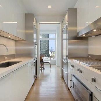 Bare Renovations - a galley kitchen with stainless steel appliances - General Contractors Near Me - New York, New York Bare Renovations - a galley kitchen with stainless steel appliances - General Contractors Near Me - New York, New York