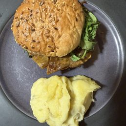 Burger with cheesy smashed potatoes