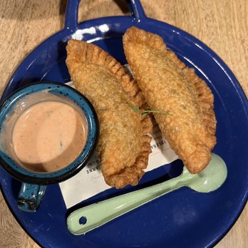 Parche - Empanada Isleñas: seafood mixto, blue crab, coconut milk, spicy labneh and pickled veggies. - Colombian Near Me - Oakland, California Parche - Empanada Isleñas: seafood mixto, blue crab, coconut milk, spicy labneh and pickled veggies. - Colombian Near Me - Oakland, California