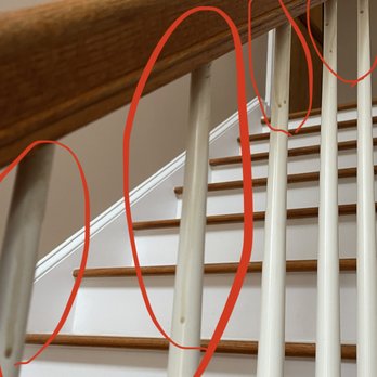 Southern Premier Hardwood Flooring - a close up of a staircase with red tape - Flooring Near Me - Pinehurst, North Carolina