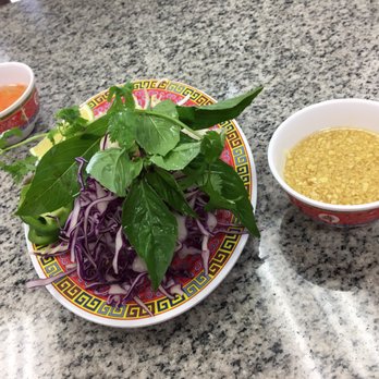 Pho Dung 2 - Seasonings. The bowl to the right is not garlic, it is ginger - Vietnamese Near Me - Houston, Texas Pho Dung 2 - Seasonings. The bowl to the right is not garlic, it is ginger - Vietnamese Near Me - Houston, Texas