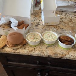 Pollo Campero - The 4-piece chicken in the rear, and then empanadas, chicken sandwich, rice, coleslaw, plantains, and beans.
