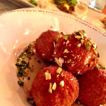 Coalition Restaurant - Goat cheese balls and pulled pork buns in the background. - Cocktail Bars Near Me - Excelsior, Minnesota Coalition Restaurant - Goat cheese balls and pulled pork buns in the background. - Cocktail Bars Near Me - Excelsior, Minnesota