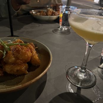 Prank - Passion Fruit Kamikaze "shot" turned into a cocktail and Prank'd Spicy Cauliflower (across the table is the Spicy Boneless Tenders) - Cocktail Bars Near Me - Los Angeles, California Prank - Passion Fruit Kamikaze "shot" turned into a cocktail and Prank'd Spicy Cauliflower (across the table is the Spicy Boneless Tenders) - Cocktail Bars Near Me - Los Angeles, California