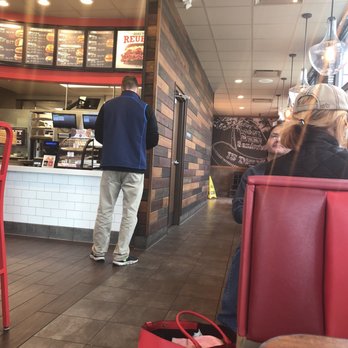 Arby's - a man and a woman in a restaurant - Fast Food Near Me - Martinsville, Indiana